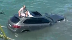 Ayvalık'ta otomobil denize uçtu! Sürücü aracın üstünde kurtarılmayı bekledi